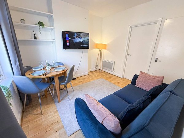 Living and dining space in NourNest’s Hackney Road apartment