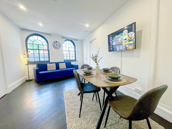 Living and dining space in NourNest’s Old Street apartment