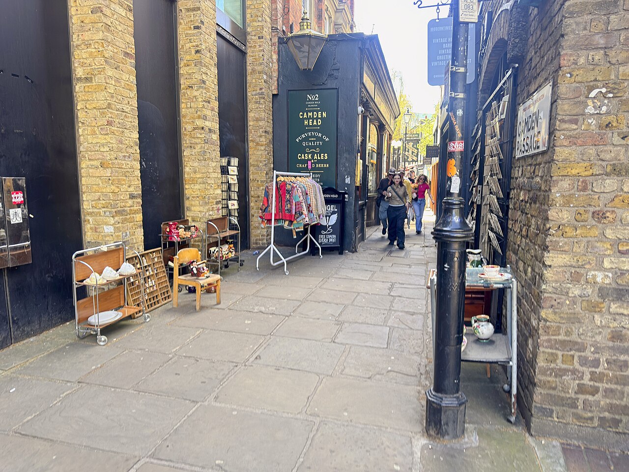 Antiques and vintage displays along Camden Passage beside the Camden Head pub